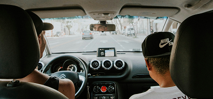 Instructor and student in a car