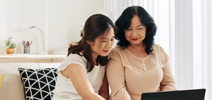 Parent and student exploring a course on a laptop