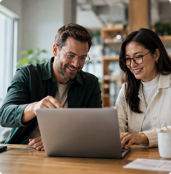 Two colleagues exploring partnership opportunities on a laptop
